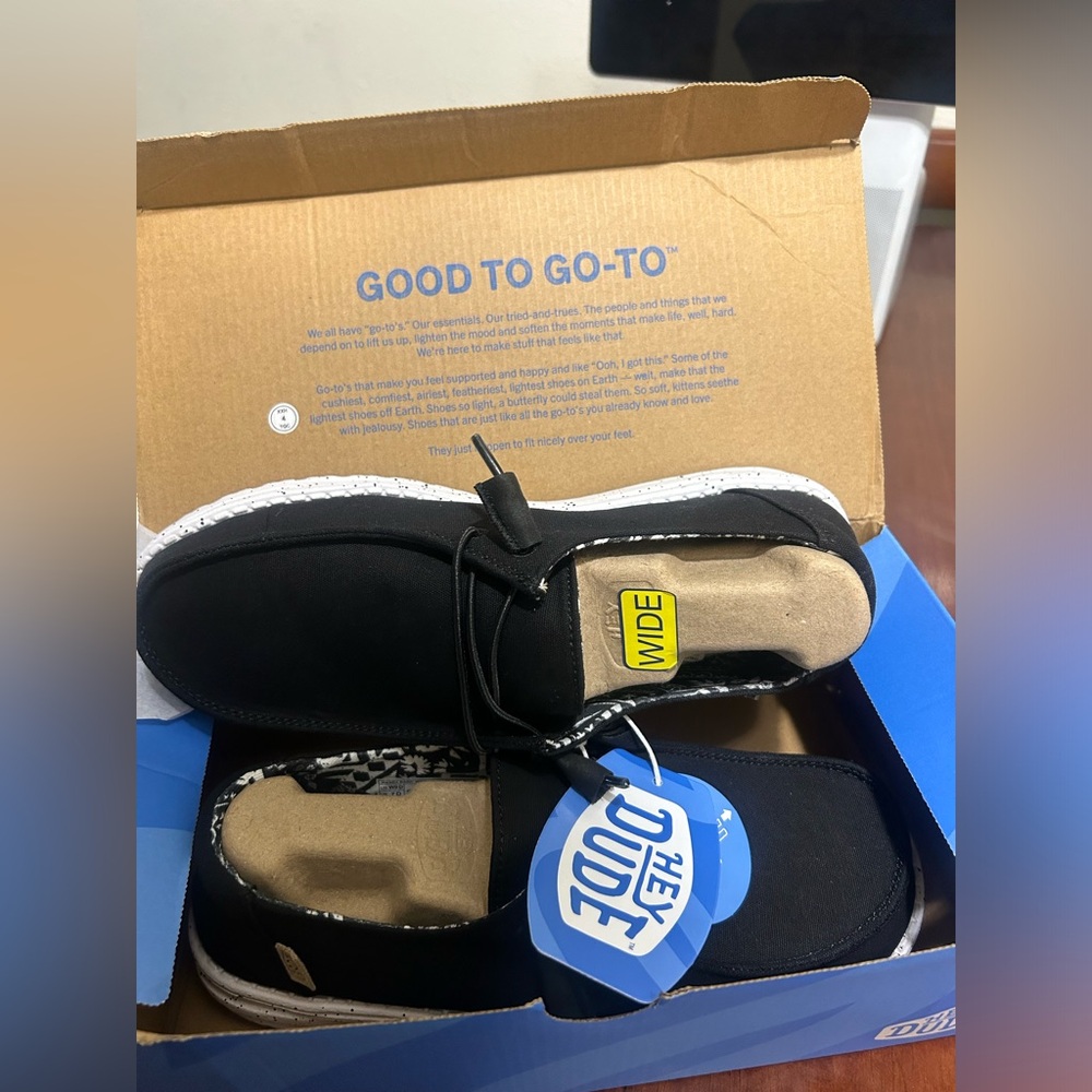 HEY DUDE SHOES WITH ALL TAGS, ORIGINAL BOX, AND EXTRA SHOE LACES. Wide fitting.